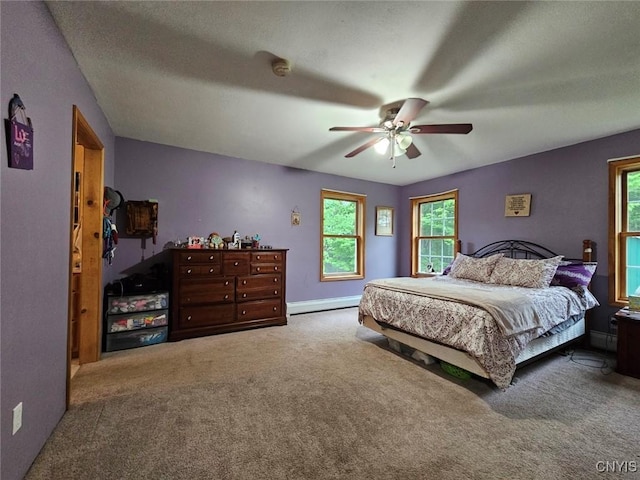 437 Nye Rd, Virgil, NY 13045 - bedroom with carpet flooring, a baseboard heating unit, multiple windows, and ceiling fan