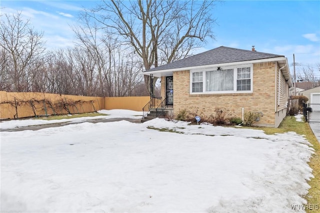 152 Nicholson St, Buffalo, NY 14216 - view of front facade with brick siding and roof with shingles
