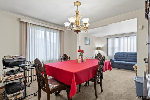 152 Nicholson St, Buffalo, NY 14216 - dining space with carpet flooring and a chandelier