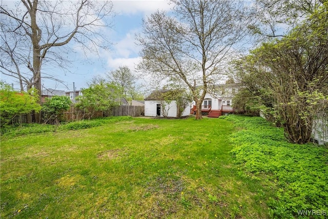 view of yard featuring a wooden deck