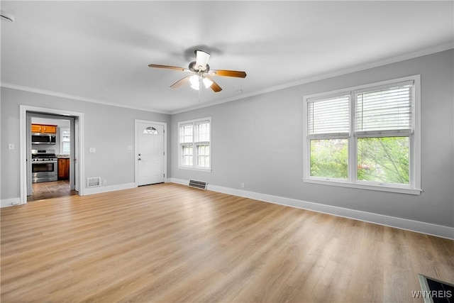 unfurnished living room featuring crown molding, baseboards, a ceiling fan, and light wood-style flooring