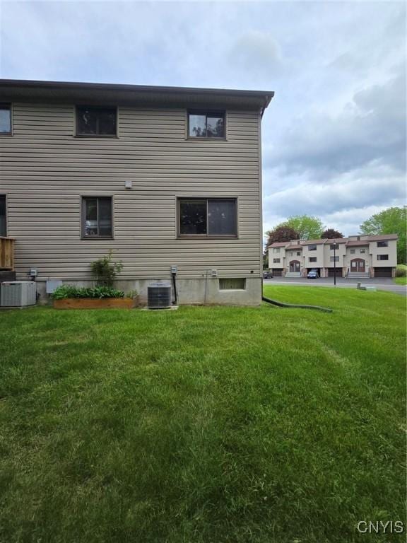 332 Cameco Cir, Salina, NY 13090 - rear view of house with a lawn and cooling unit