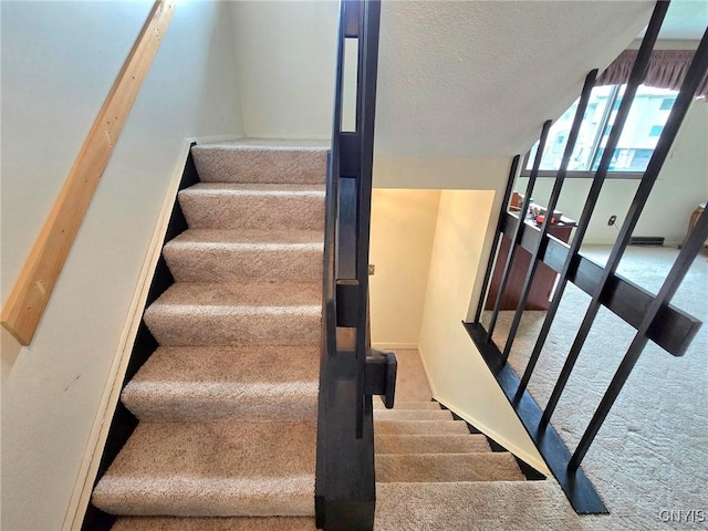 332 Cameco Cir, Salina, NY 13090 - staircase with carpet flooring, a textured ceiling, and baseboards