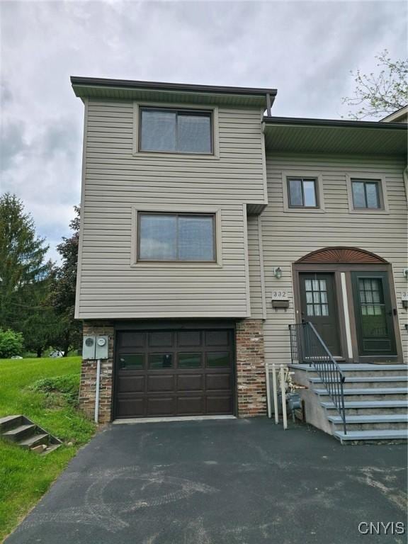 332 Cameco Cir, Salina, NY 13090 - townhome / multi-family property with an attached garage and driveway