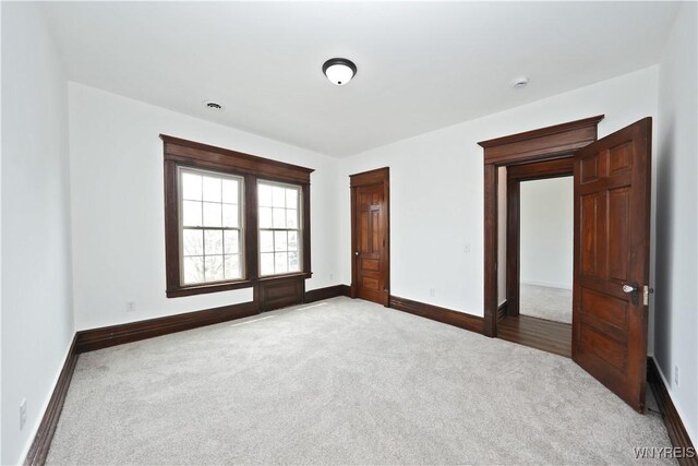 249 E St, Buffalo, NY 14207 - carpeted spare room with baseboards and a smoke detector