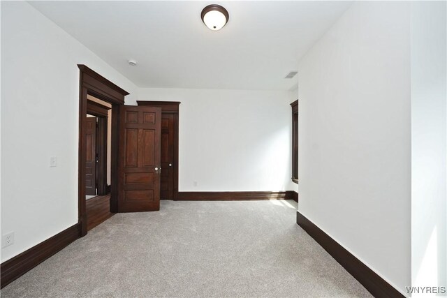 249 E St, Buffalo, NY 14207 - carpeted spare room featuring baseboards