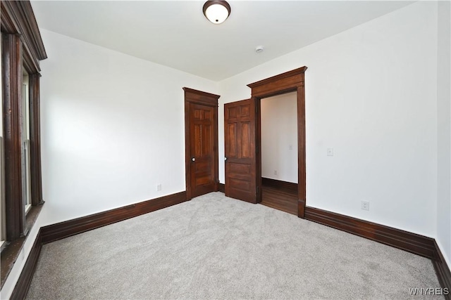 249 E St, Buffalo, NY 14207 - unfurnished room with dark carpet and baseboards
