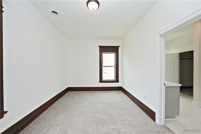 249 E St, Buffalo, NY 14207 - spare room featuring carpet floors and baseboards