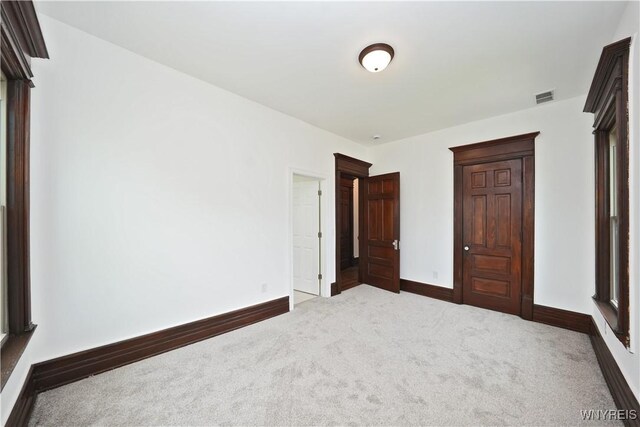 249 E St, Buffalo, NY 14207 - unfurnished bedroom with carpet and baseboards