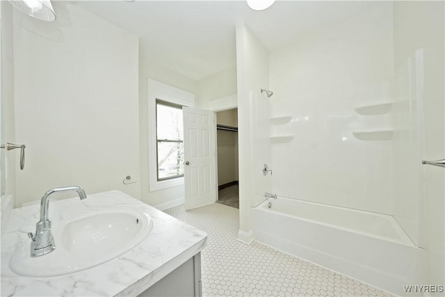 249 E St, Buffalo, NY 14207 - bathroom with vanity, bathtub / shower combination, tile patterned floors, and baseboards