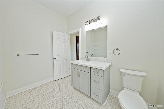 249 E St, Buffalo, NY 14207 - bathroom with toilet, baseboards, and vanity