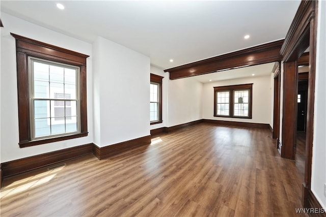 249 E St, Buffalo, NY 14207 - unfurnished living room with wood finished floors, baseboards, and recessed lighting