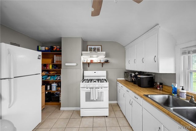 kitchen with white appliances, a sink, ceiling fan, and white cabinets