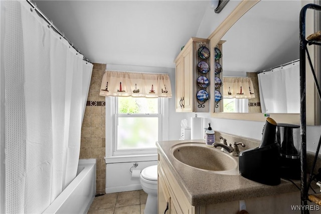 full bathroom with tile patterned floors, toilet, vanity, and shower / bath combination with curtain