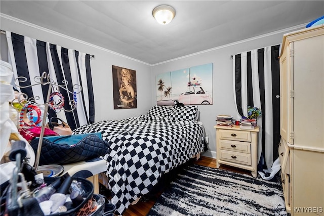 bedroom featuring wood finished floors and ornamental molding
