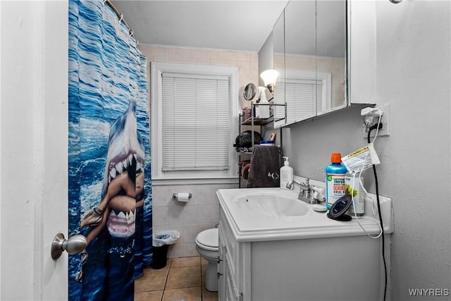 bathroom featuring tile patterned floors, vanity, and toilet