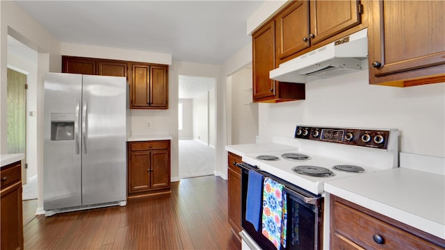 85 Kalyna Dr, Irondequoit, NY 14617 - kitchen with stainless steel refrigerator with ice dispenser, white electric range oven, under cabinet range hood, light countertops, and dark wood finished floors
