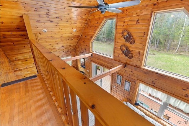 301 Silverstone Rd, Russia, NY 13438 - corridor with an upstairs landing, wooden walls, and wood-type flooring