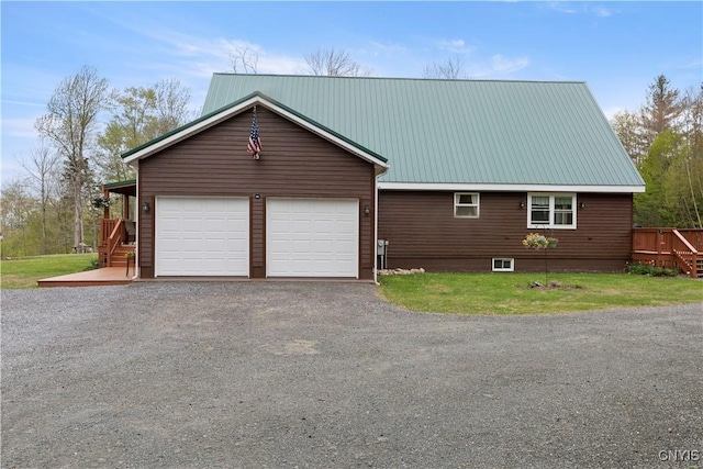 301 Silverstone Rd, Russia, NY 13438 - view of side of property featuring a garage, driveway, metal roof, stairs, and a lawn