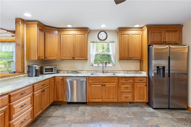 301 Silverstone Rd, Russia, NY 13438 - kitchen featuring stainless steel appliances, a sink, light stone countertops, recessed lighting, and stone finish flooring