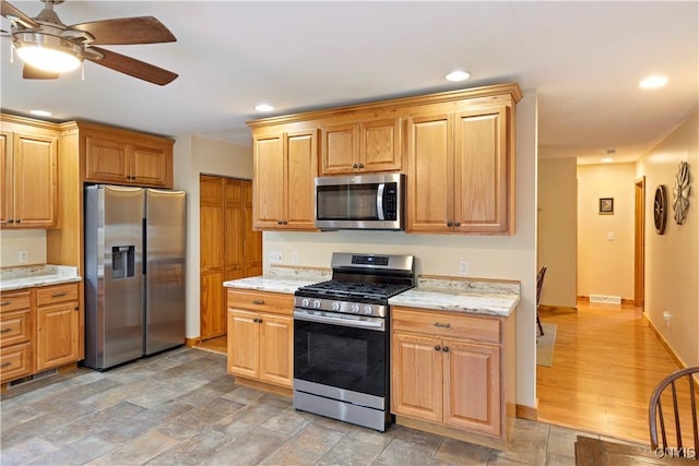 301 Silverstone Rd, Russia, NY 13438 - kitchen featuring appliances with stainless steel finishes, a ceiling fan, light stone countertops, recessed lighting, and light stone finish floors