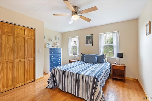 301 Silverstone Rd, Russia, NY 13438 - bedroom featuring light wood-type flooring, ceiling fan, a closet, and baseboards