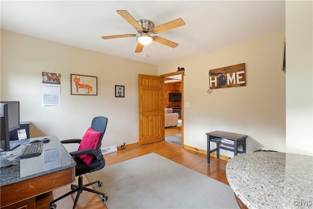 301 Silverstone Rd, Russia, NY 13438 - office area featuring ceiling fan, wood finished floors, and baseboards