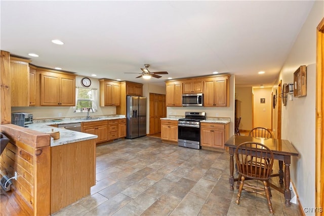 301 Silverstone Rd, Russia, NY 13438 - kitchen with stainless steel appliances, recessed lighting, a sink, a ceiling fan, and a peninsula