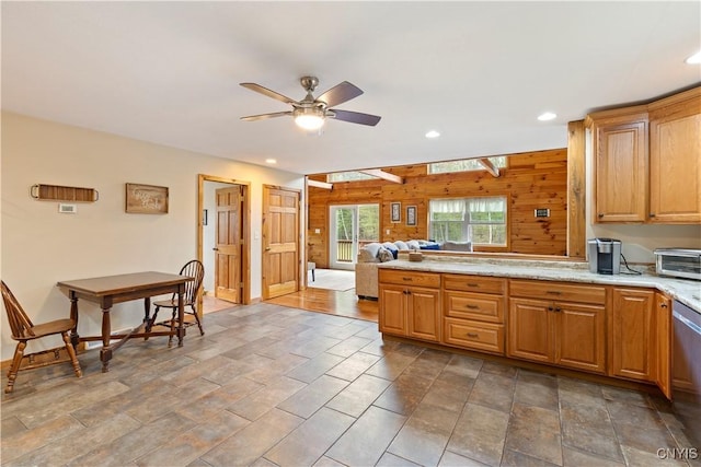 301 Silverstone Rd, Russia, NY 13438 - kitchen with wood walls, ceiling fan, recessed lighting, a peninsula, and open floor plan