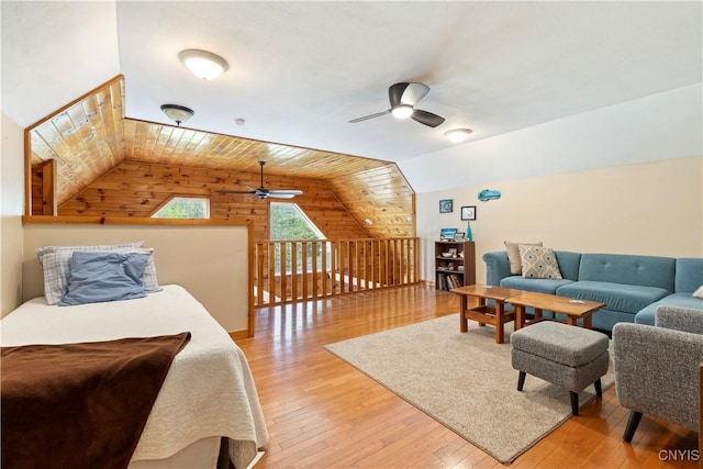 301 Silverstone Rd, Russia, NY 13438 - living room with wooden walls, ceiling fan, vaulted ceiling, light wood finished floors, and wooden ceiling