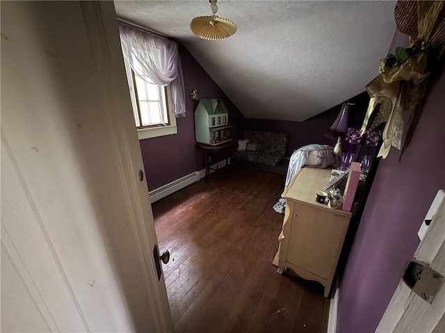 3645 County Highway 12, Kortright, NY 13739 - bedroom with baseboard heating, lofted ceiling, dark wood finished floors, and a textured ceiling