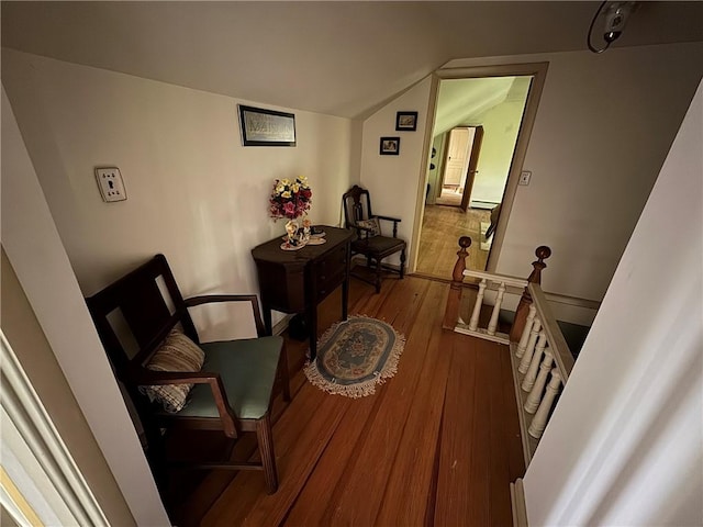 3645 County Highway 12, Kortright, NY 13739 - living area featuring wood finished floors, an upstairs landing, lofted ceiling, and a baseboard radiator