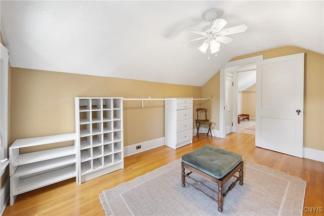 457 Broad St, Oneida-Inside, NY 13421 - living area featuring ceiling fan, vaulted ceiling, wood finished floors, and baseboards