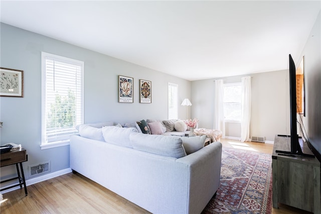 111 Barlow Dr, Greece, NY 14626 - living room featuring healthy amount of natural light, light wood-style flooring, and baseboards