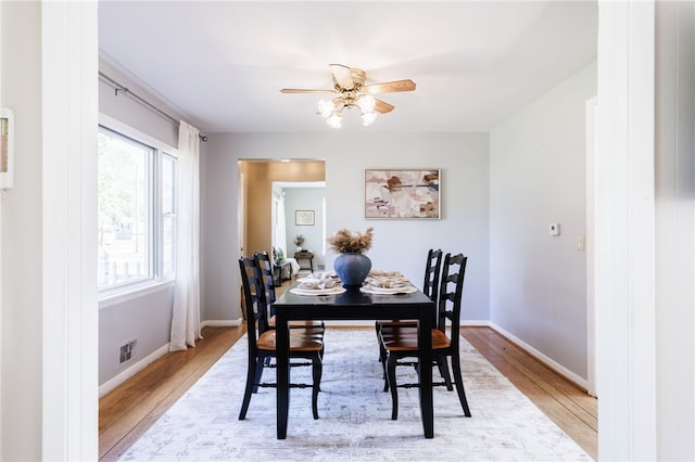 111 Barlow Dr, Greece, NY 14626 - dining space featuring light wood-type flooring, a ceiling fan, and baseboards