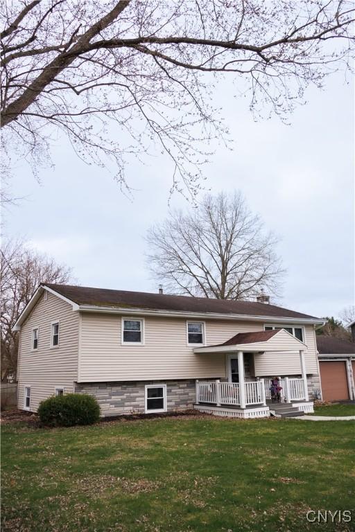 95 Briarcliff Dr, Veteran, NY 14845 - back of property with a lawn, a porch, and a chimney