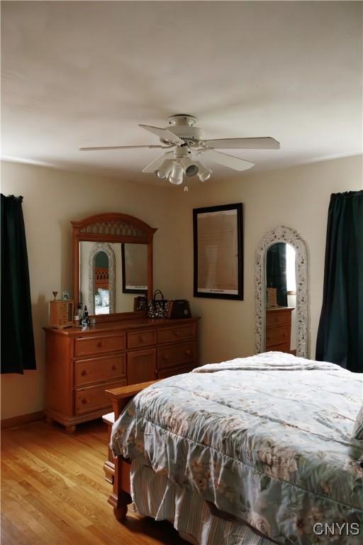 95 Briarcliff Dr, Veteran, NY 14845 - bedroom with light wood-type flooring and ceiling fan