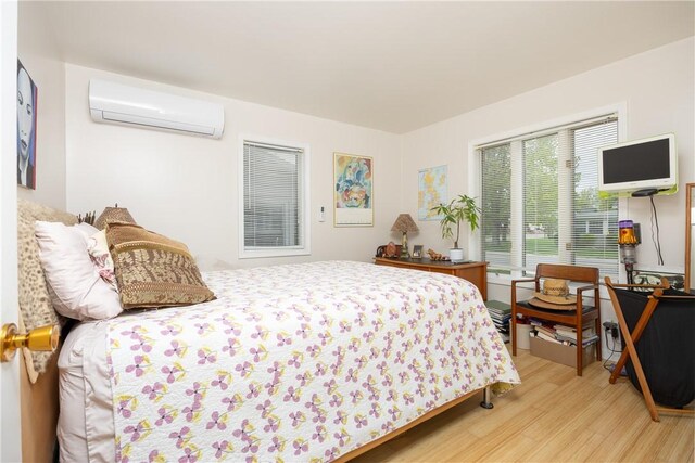 8508 Wickham Blvd, Sodus, NY 14555 - bedroom featuring a wall unit AC and wood finished floors