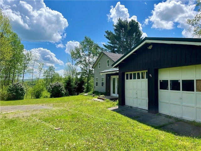 376 Upper Dutch Hill Rd, Milford, NY 13820 - view of property exterior featuring a yard, a garage, and driveway
