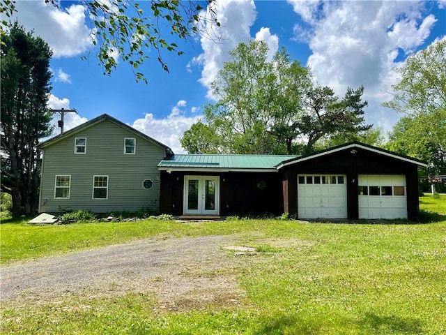 376 Upper Dutch Hill Rd, Milford, NY 13820 - view of front of property featuring french doors, driveway, a front yard, and an attached garage