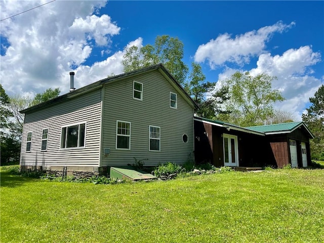 376 Upper Dutch Hill Rd, Milford, NY 13820 - rear view of property featuring french doors, a yard, and an attached garage