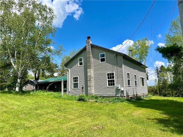 376 Upper Dutch Hill Rd, Milford, NY 13820 - view of side of home with a chimney and a yard