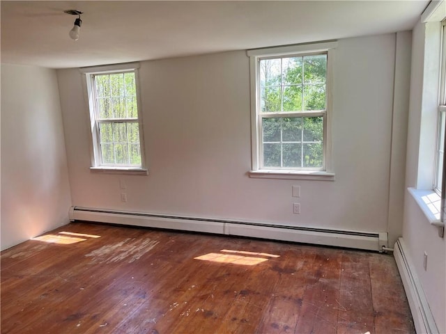 376 Upper Dutch Hill Rd, Milford, NY 13820 - unfurnished room featuring baseboard heating, hardwood / wood-style flooring, a baseboard heating unit, and healthy amount of natural light