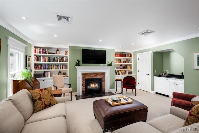 85 Windsor Ave, Buffalo, NY 14209 - living room with crown molding, built in shelves, carpet, a fireplace with flush hearth, and recessed lighting