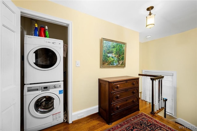 85 Windsor Ave, Buffalo, NY 14209 - washroom with estacked washer and dryer, wood finished floors, and baseboards