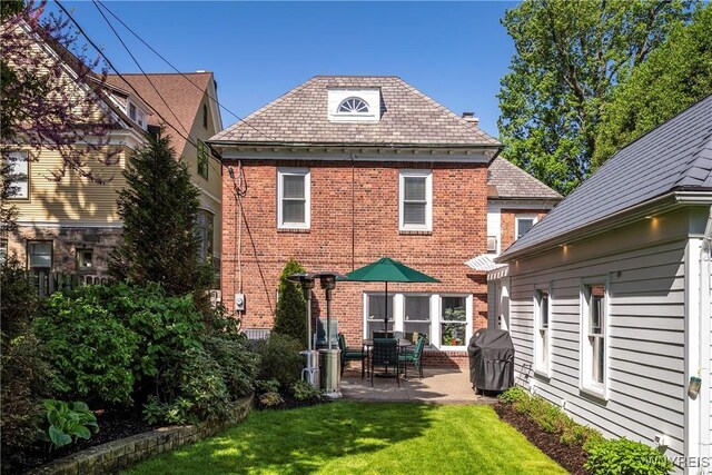 85 Windsor Ave, Buffalo, NY 14209 - back of property featuring a patio, a yard, brick siding, and a high end roof