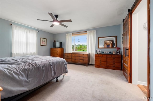 6924 Lebanon Rd, Lebanon, NY 13332 - bedroom featuring light carpet, a barn door, and ceiling fan