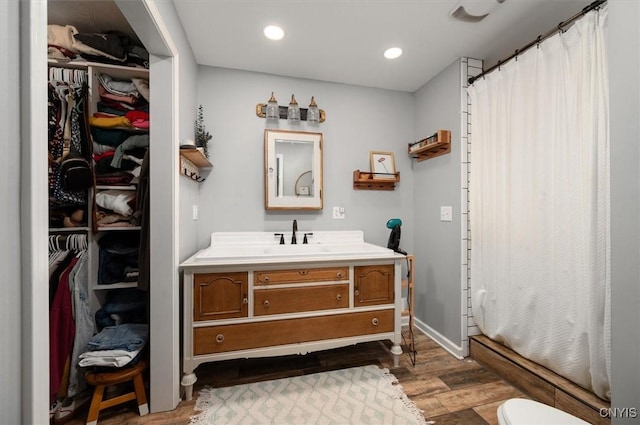6924 Lebanon Rd, Lebanon, NY 13332 - full bath with wood finished floors, vanity, a shower with curtain, recessed lighting, and a spacious closet
