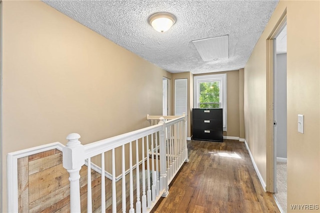 7508 Lakeside Rd, Ontario, NY 14519 - hall with an upstairs landing, a textured ceiling, wood finished floors, and baseboards