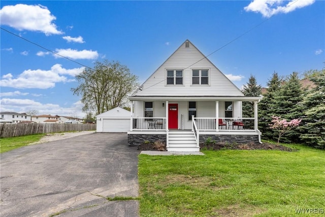 4830 Transit Rd, Cheektowaga, NY 14043 - bungalow-style house featuring a porch, a garage, and an outbuilding